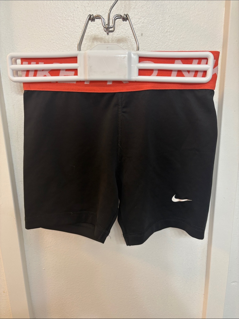 Nike Black Shorts with Red Waistband and White Swoosh Logo